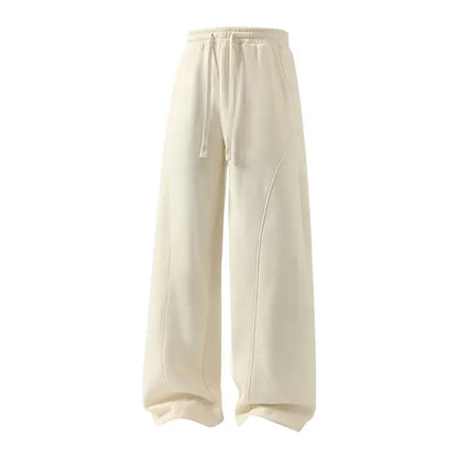Men's Solid-Color Drawstring Pants with Curved Blade Design - Comfortable and Versatile Trousers for All Seasons and Everyday Layering in Beige.