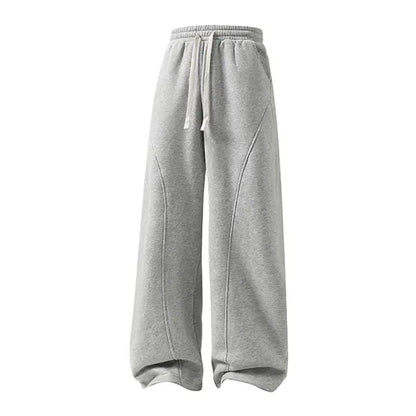 Men's Solid-Color Drawstring Pants with Curved Blade Design - Comfortable and Versatile Trousers for All Seasons and Everyday Layering in Beige.