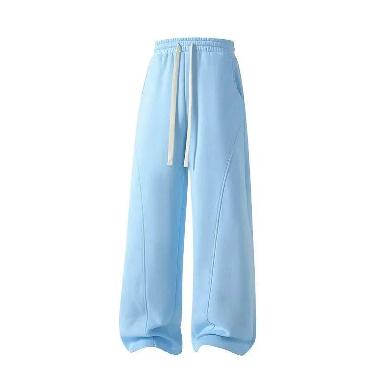 Men's Solid-Color Drawstring Pants with Curved Blade Design - Comfortable and Versatile Trousers for All Seasons and Everyday Layering in Beige.